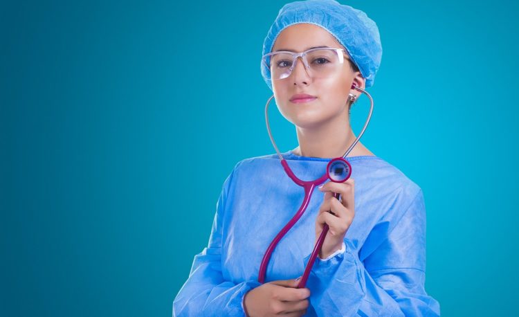 holding a stethoscope